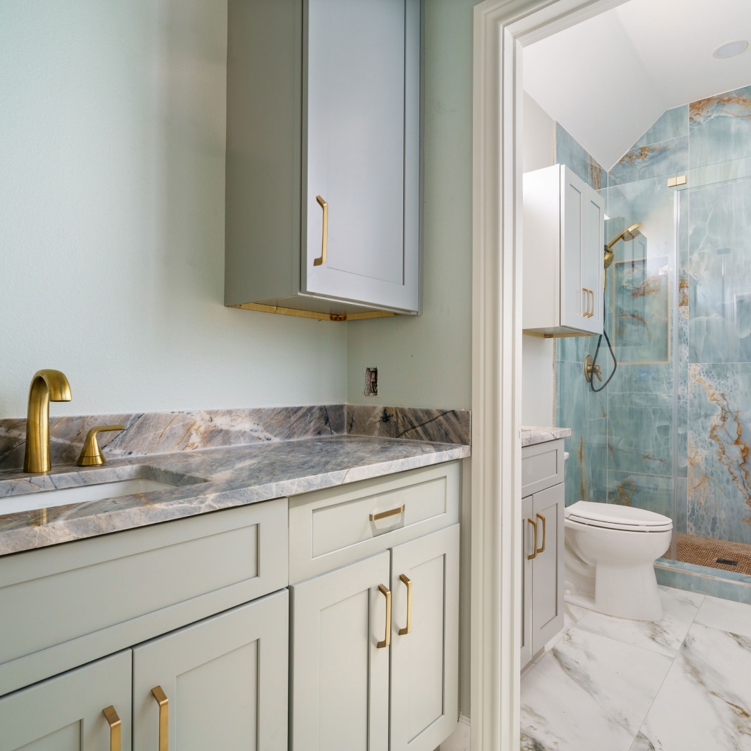 bathroom sinks with countertop, toilet and shower