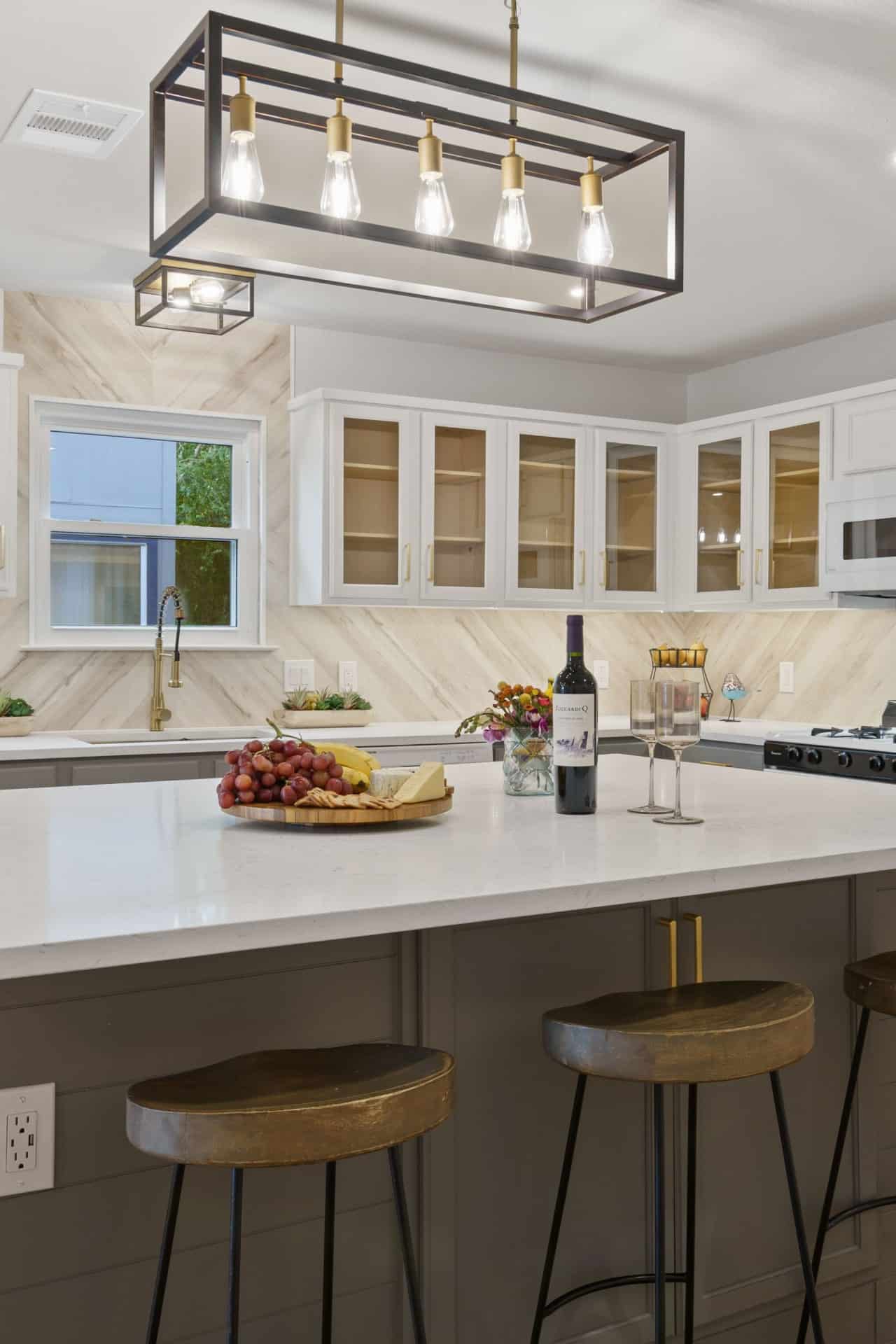 beautiful kitchen with lighting fixture and granite islandtop