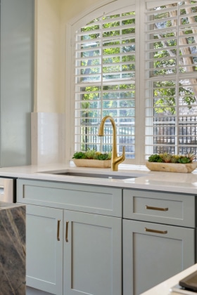 beautifully renovated sink in a new kitchen