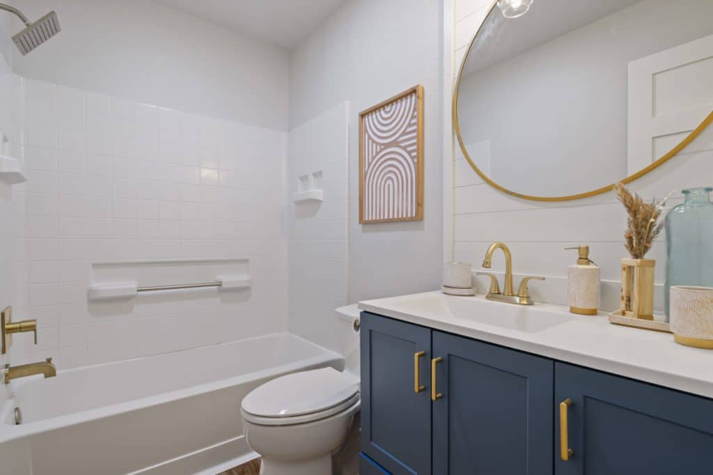 remodeled bathroom with mirror and sink